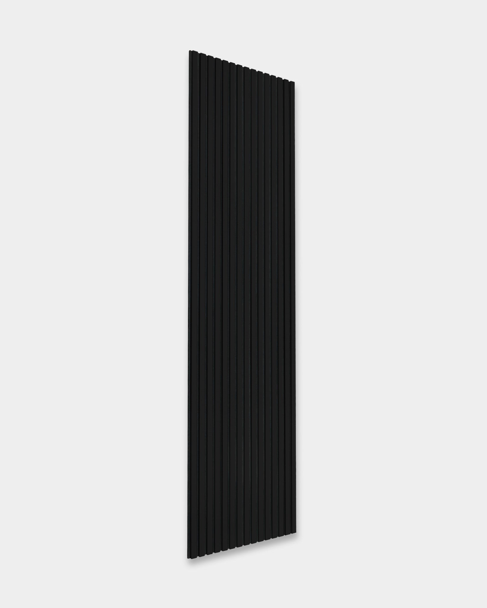 WoodUpp Akupanel vertical black acoustic panel with evenly spaced ridges for sound absorption, displayed against a light gray background.